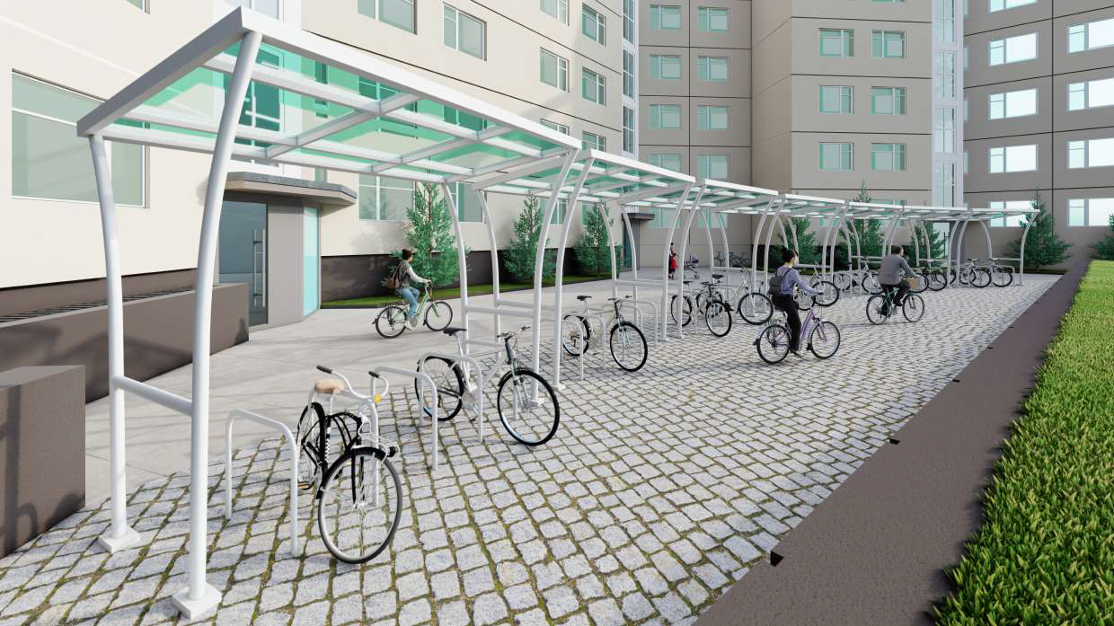 Überdachte Fahrradstellplätze im DRAKEPARK Berlin mit moderner Architektur und Wohneinheiten im Hintergrund